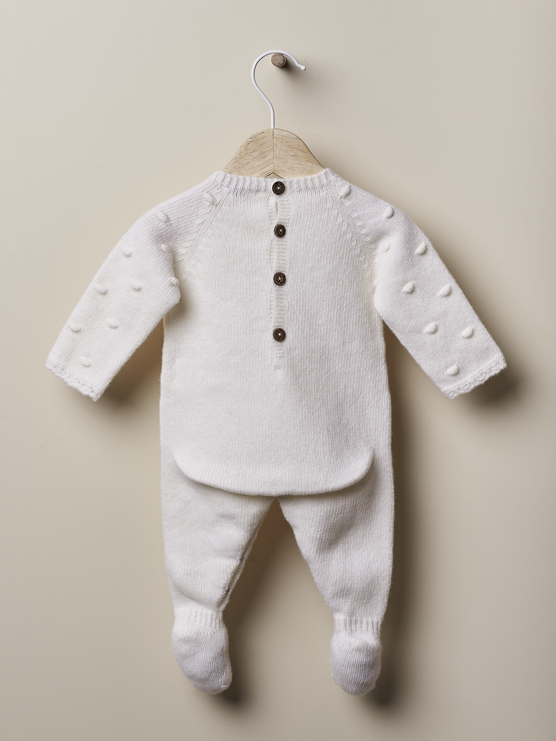 Babygrow tricotado de lã