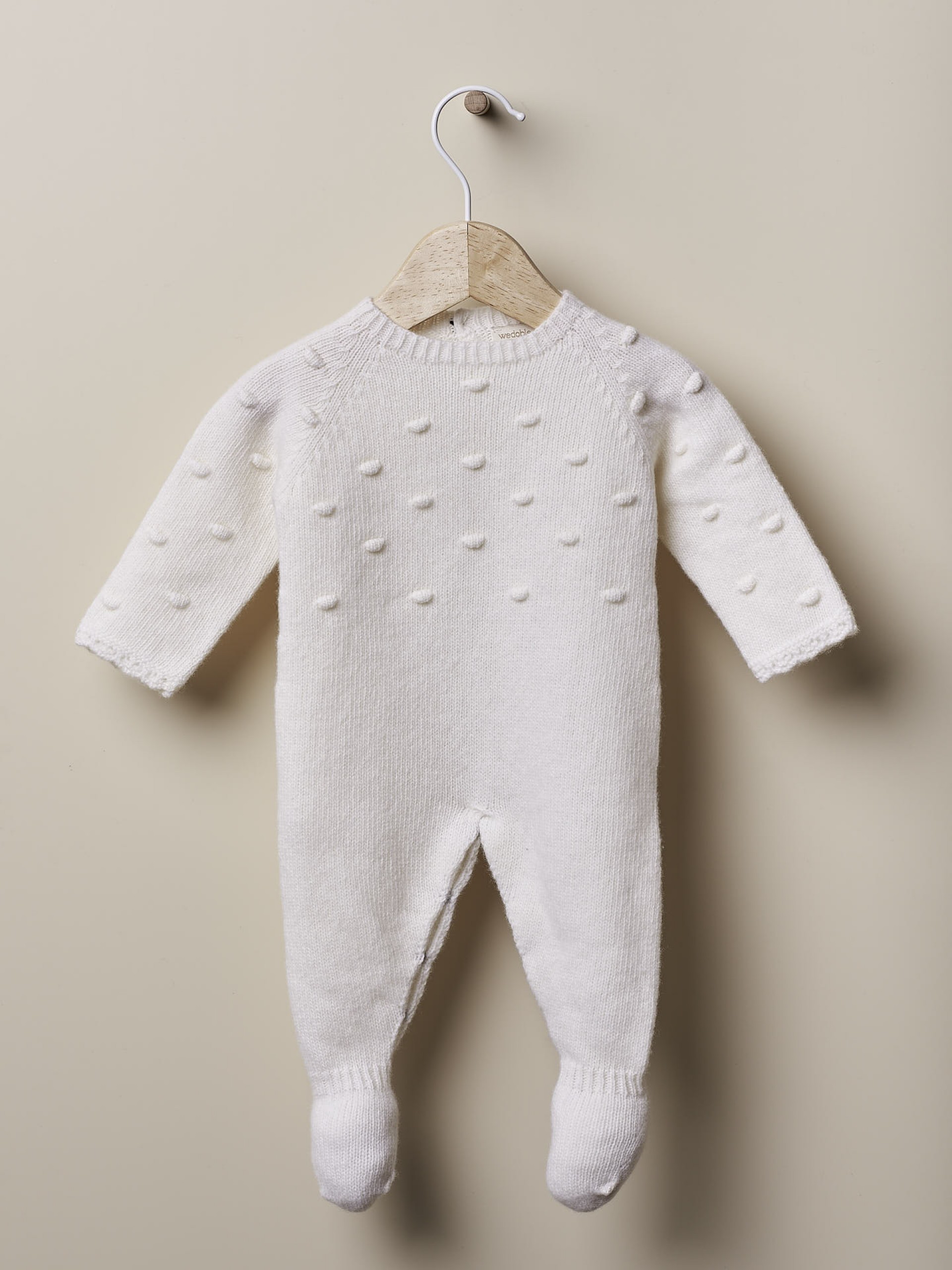 Babygrow tricotado de lã
