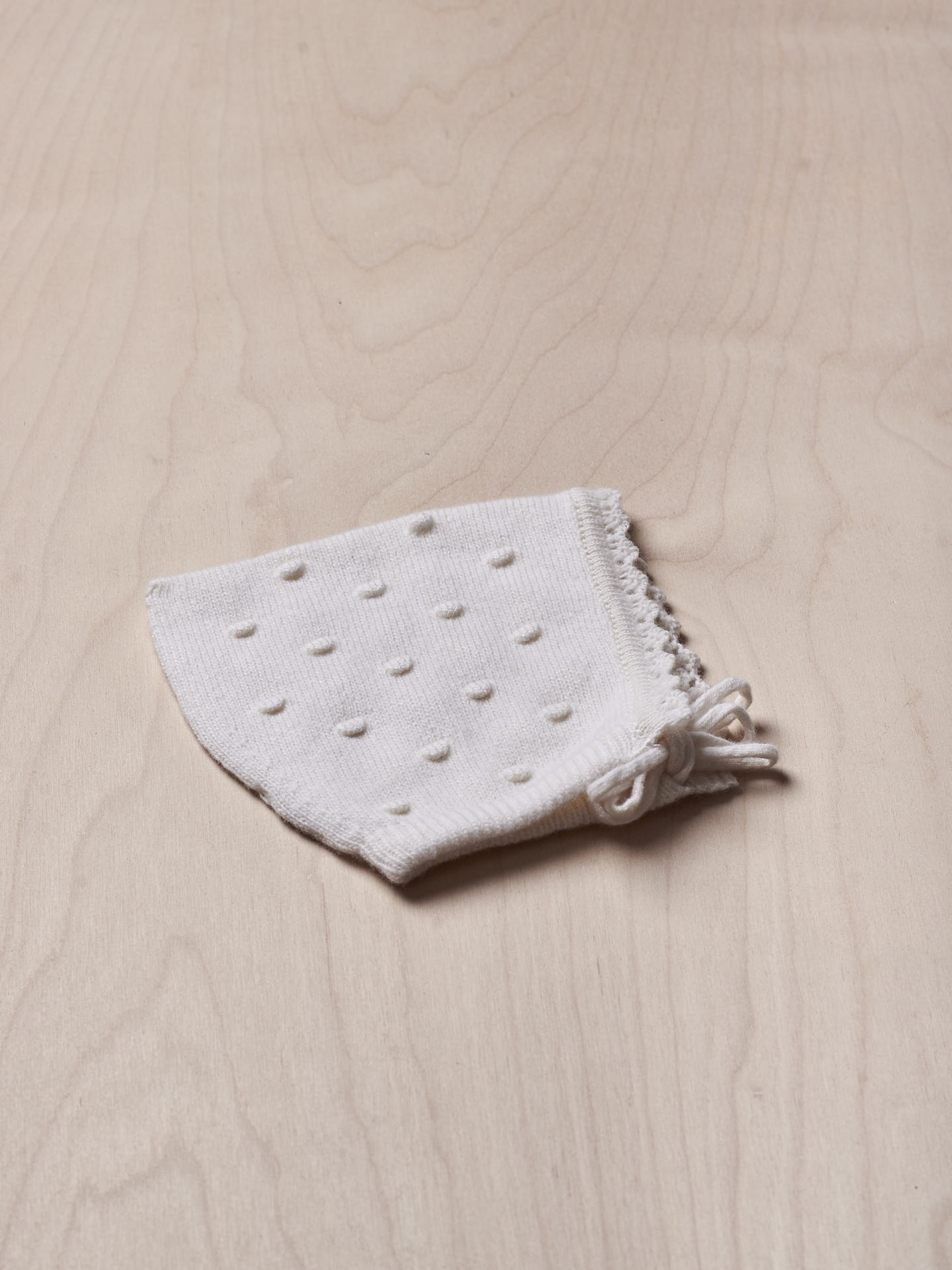 Touca tricotada de lã