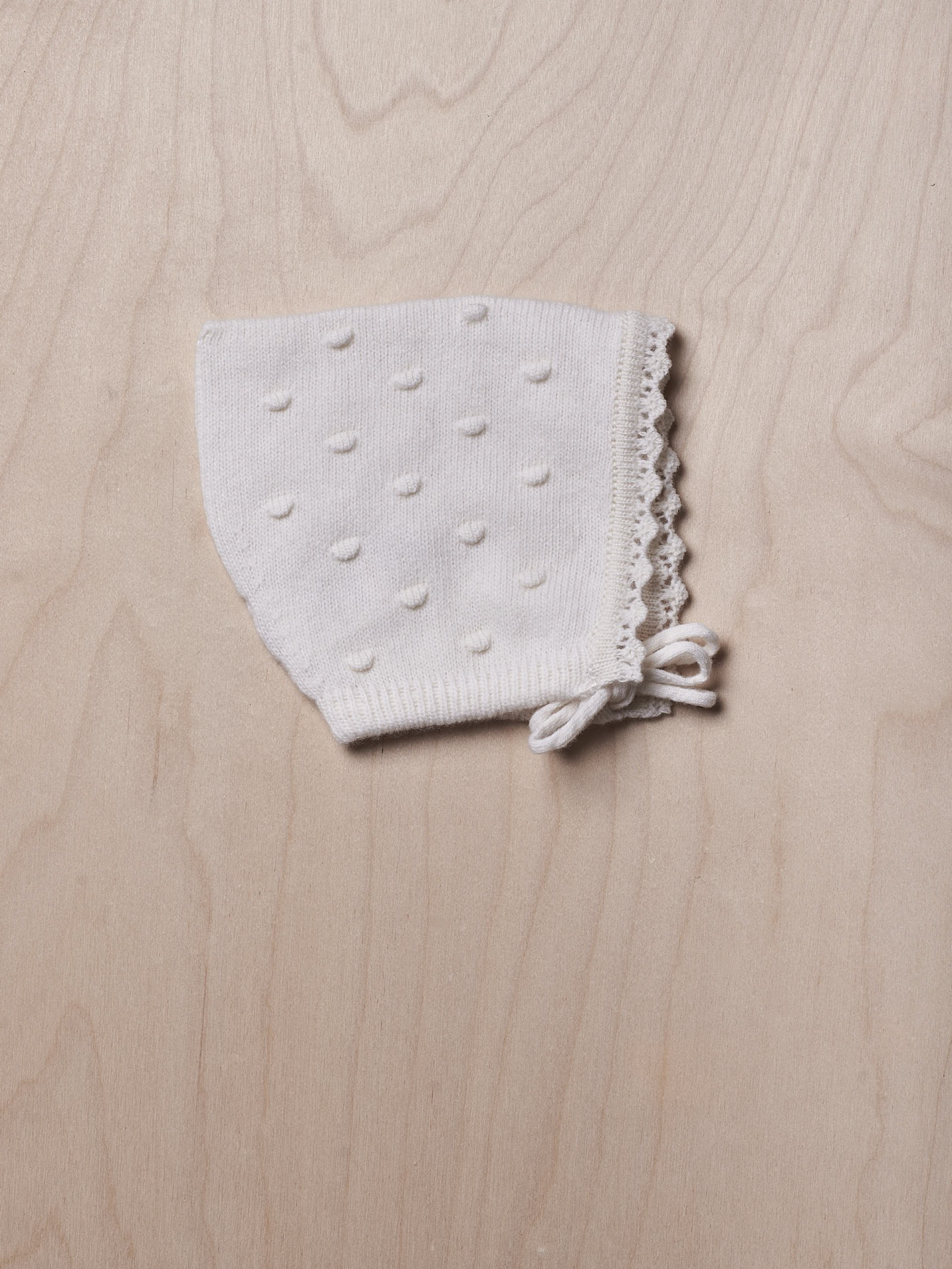 Touca tricotada de lã