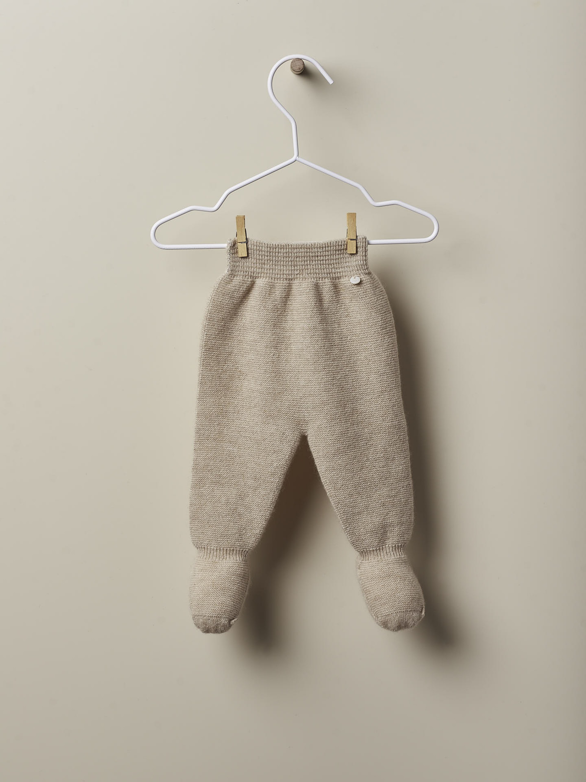 Calças com pé de caxemira