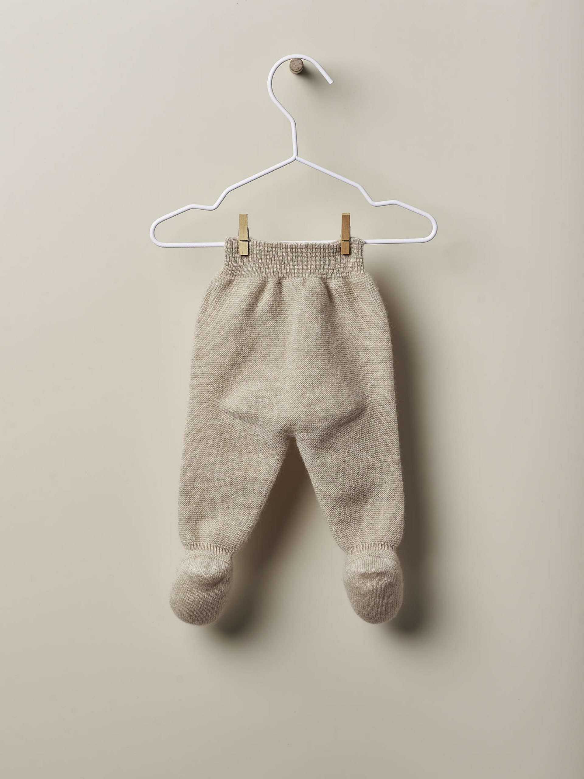 Calças com pé de caxemira