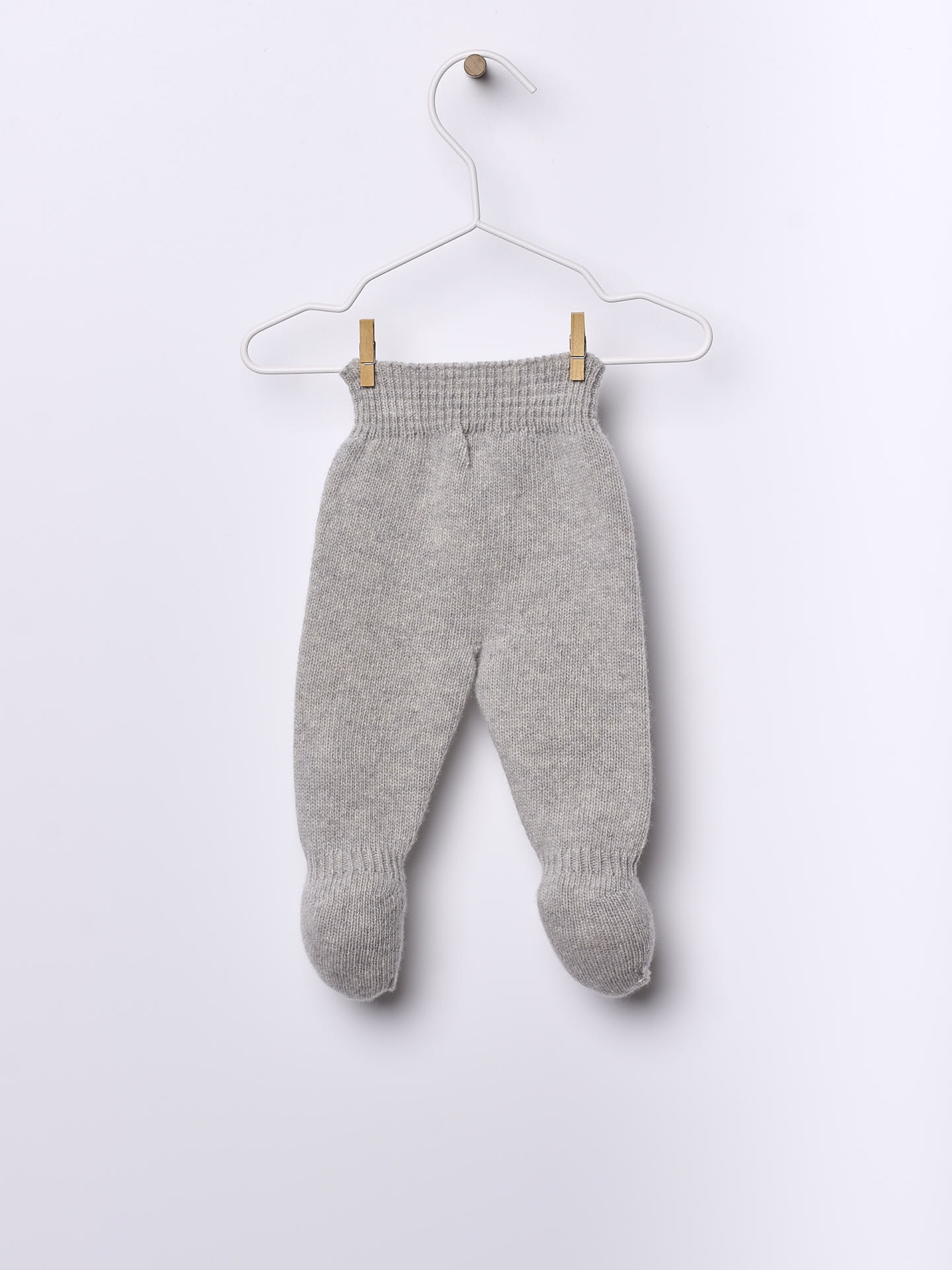 Calças com pé tricotadas